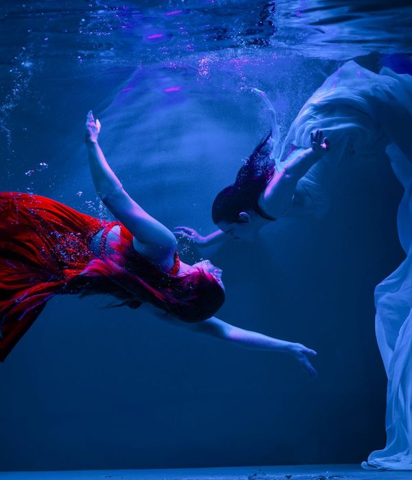 Woman in a dynamic yoga pose, illustrating fluidity and movement.